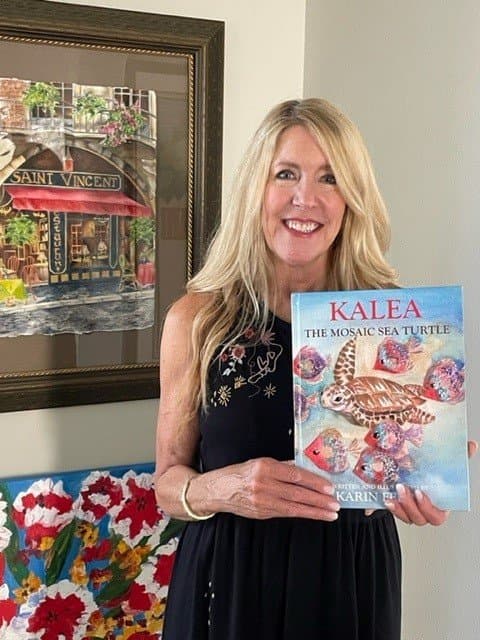 Karin Ferro holding Kalea the Mosaic Sea Turtle